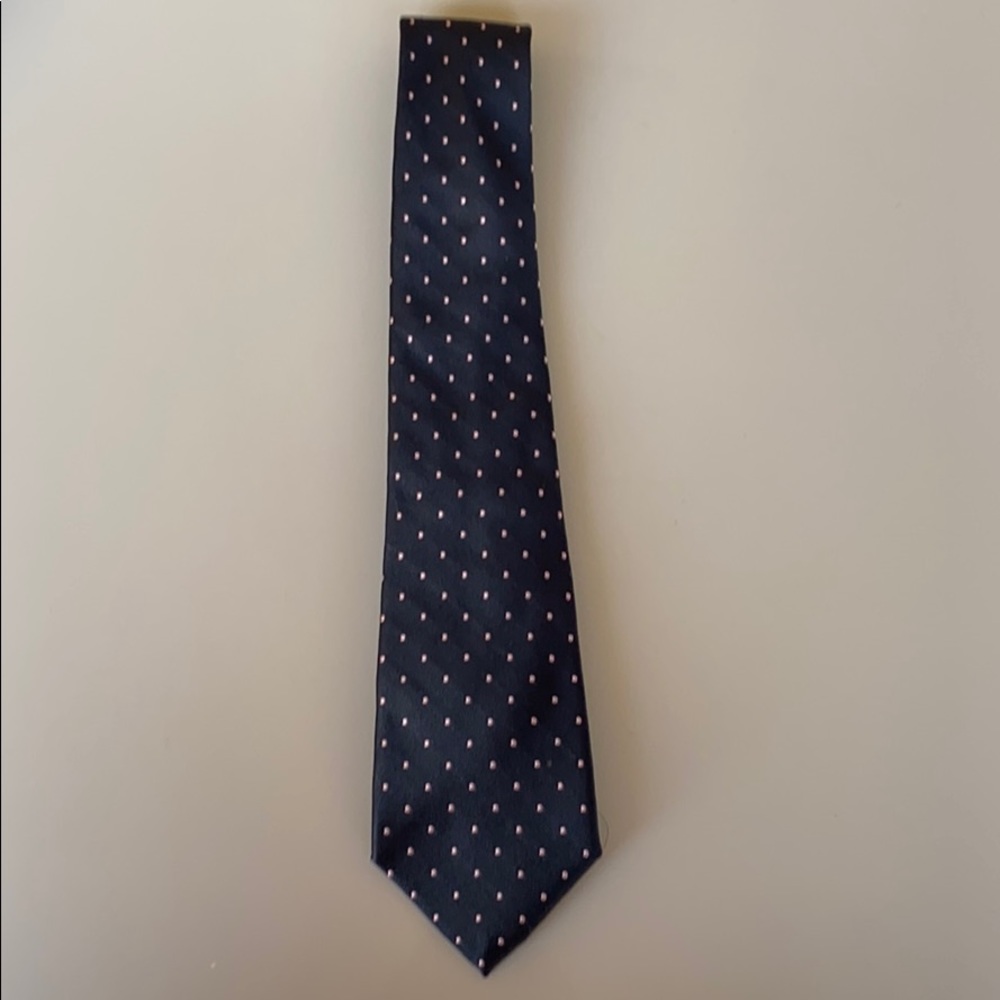 Pink polka dot tie on navy blue